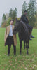 Video featuring two men modeling autumn coats, one in a camel coat and one in a black coat on horseback, promoting the new season layered collection